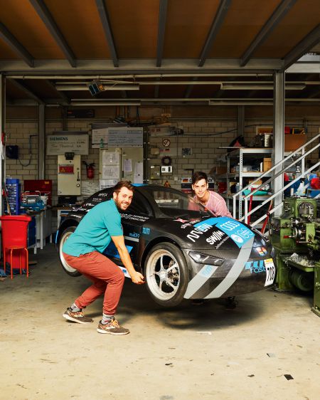 The students Ludwig Streller and Fabian Menz from TUfast Eco with a car built by them