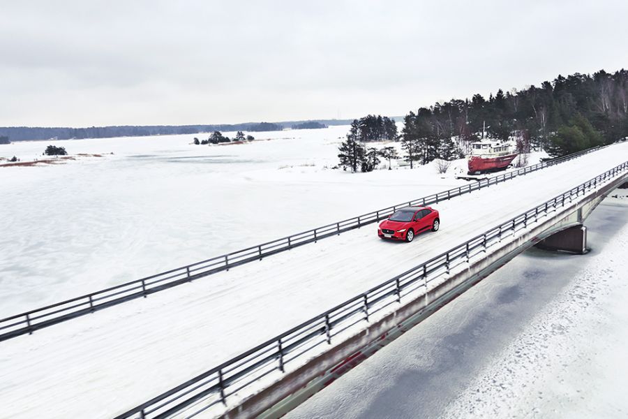 Hush Hour: exploring the Finnish wilderness with the Jaguar I-PACE The Jaguar I-Pace drives on a snowy bridge over Finland's largest lake