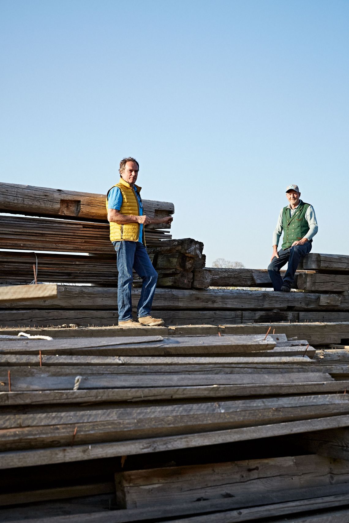 Anderl and Karl-Michael Friedinger in an interview for SeeMagazin Anderl and Karl-Michael Friedinger stand on wooden boards at a construction site