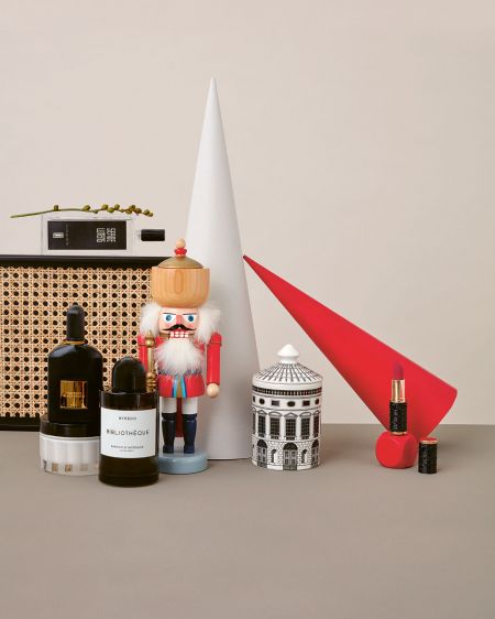 Still life with Viennese wickerwork, nutcrackers, paper cones and beauty products against a beige background