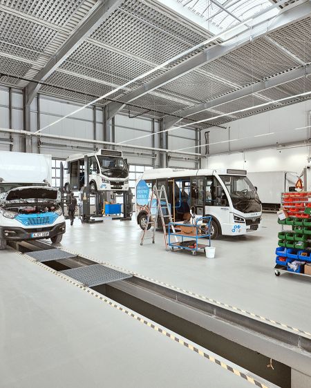 Workshop with several electric trucks
