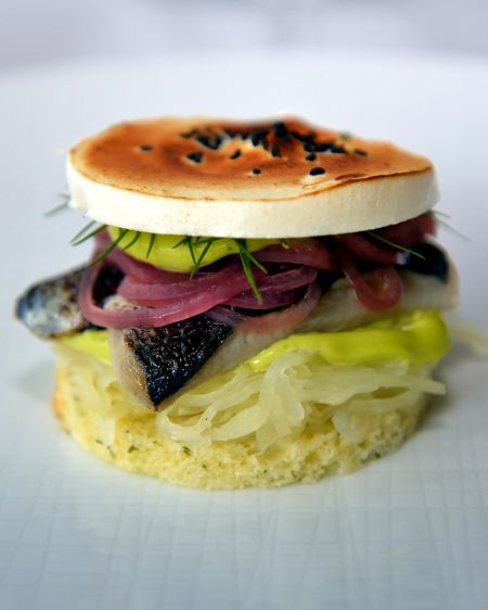 Gourmet fish sandwiches on white plate