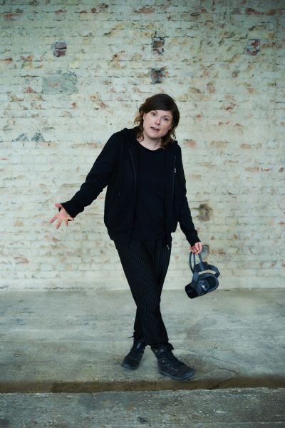 Interview Tina Lorenz for XPLR Media Tina Lorenz with VR headset infront of bright wall