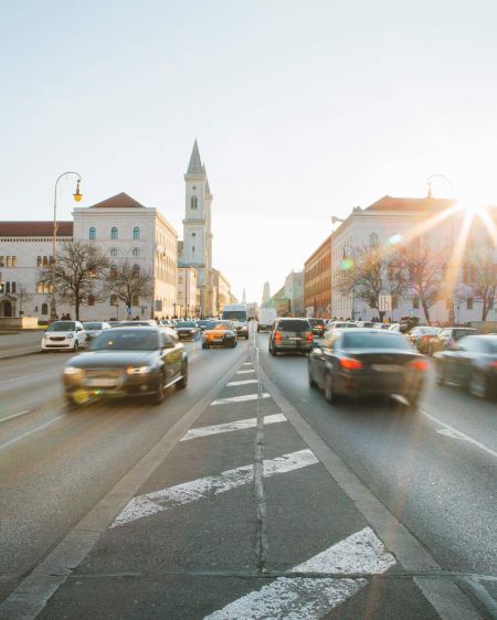 Driving cars in evening rush hour traffic on Ludwigstraße in Munich
