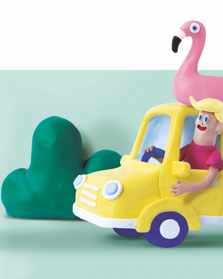 Family moulded from plasticine in yellow car on the way to holiday