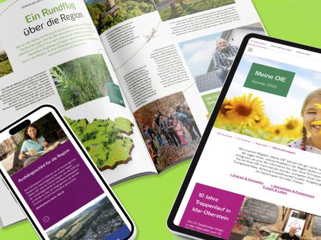 The open customer magazine “My OIE,” a smartphone, and a tablet with the digital magazine edition of OIE on a light green background.