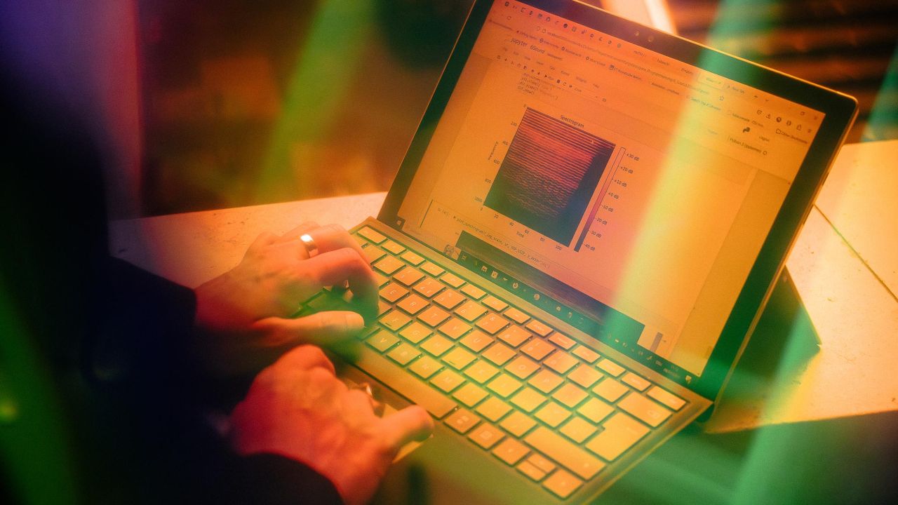 Close-up of hands typing on a laptop Close-up of hands typing on a laptop